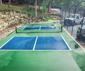 Pickleball court located across from the pool – paddles available to check out at the Treetop office during business hours.