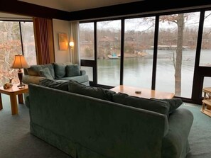 "Soak in incredible lake views from the comfort of your living room! This inviting space is perfect for relaxing and enjoying the scenery."