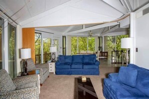 Relax and recharge in the cozy and stylish living room of The Tree Top Nest, perfect for family gatherings or a romantic evening in.