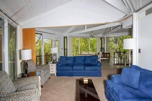 Relax and recharge in the cozy and stylish living room of The Tree Top Nest, perfect for family gatherings or a romantic evening in.