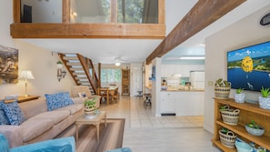 "Bright and inviting! Our open-concept living area flows seamlessly into the kitchen, providing ample space for everyone to enjoy."