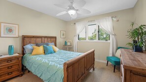 "Drift off to peaceful sleep in this charming bedroom, designed for ultimate comfort and relaxation after a day on the lake."