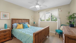 "Drift off to peaceful sleep in this charming bedroom, designed for ultimate comfort and relaxation after a day on the lake."