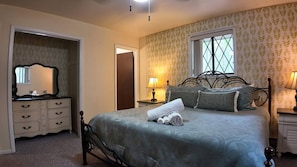 Primary suite on the main level with direct access to a private bathroom.