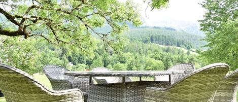 Furniture, Outdoor Furniture, Groundcover, Wicker, Garden, Outdoor Table, Chair, Lawn, Shade, Landscaping