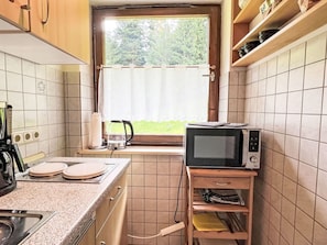Wood, Kitchen, Kitchen Appliance, Flooring, Interior Design, Countertop, Furniture, Major Appliance, Room, Floor