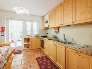 Interior Design, Kitchen, Wood, Furniture, Cabinetry, Flooring, Kitchen Appliance, Floor, Room, Countertop