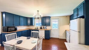 Gather, dine, and enjoy—kitchen and dining in one cozy space.