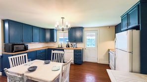 Gather, dine, and enjoy—kitchen and dining in one cozy space.