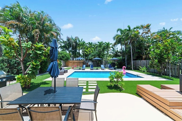 Dine alfresco on the back patio before performing an epic cannonball!