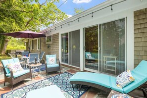 Whether you’re gathering for a meal or enjoying a quiet morning coffee, this sun-dappled patio offers the best seat in the house.