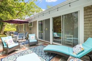 Whether you’re gathering for a meal or enjoying a quiet morning coffee, this sun-dappled patio offers the best seat in the house.
