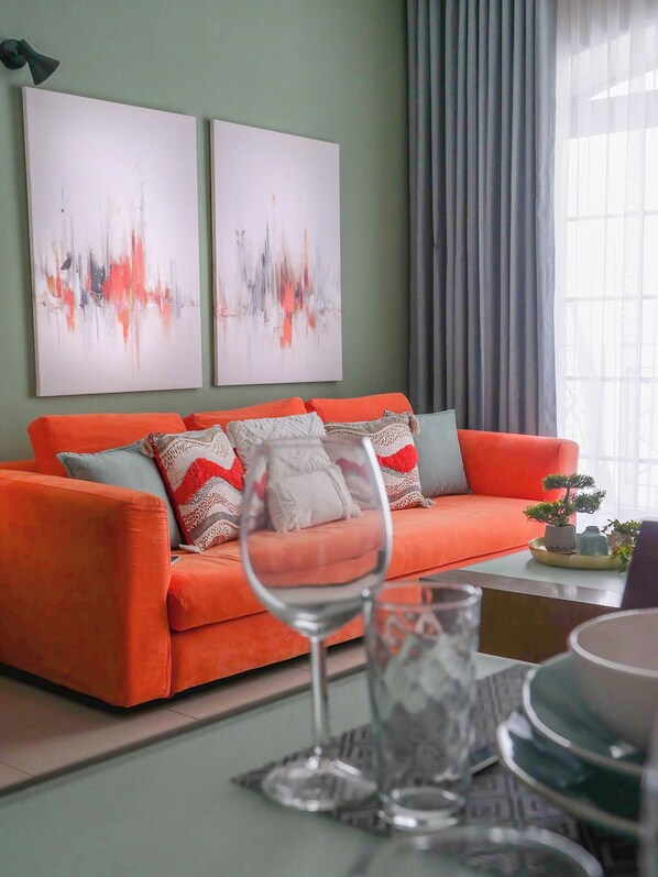 The heart of the living room, our notorious orange couch