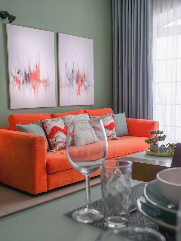The heart of the living room, our notorious orange couch