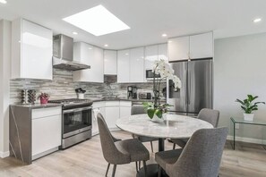 Self-contained kitchen with large fridge to store your food.