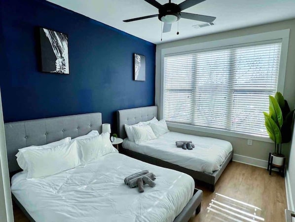 Experience the perfect blend of comfort and style in this spacious bedroom, designed for restful nights and rejuvenating mornings.