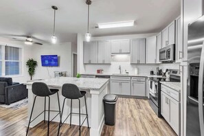 With an open layout and modern appliances, cooking in this kitchen is as fun as it is functional, making every meal a delight.