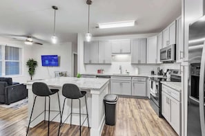 With an open layout and modern appliances, cooking in this kitchen is as fun as it is functional, making every meal a delight.