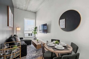Enjoy evenings filled with laughter and conversation in this spacious living room, where every detail is crafted for the ultimate hosting experience.
