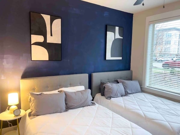 Experience the perfect blend of comfort and style in this spacious bedroom, designed for restful nights and rejuvenating mornings.
