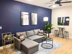 Enjoy evenings filled with laughter and conversation in this spacious living room, where every detail is crafted for the ultimate hosting experience.