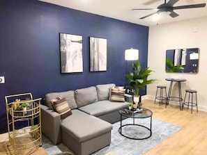 Enjoy evenings filled with laughter and conversation in this spacious living room, where every detail is crafted for the ultimate hosting experience.