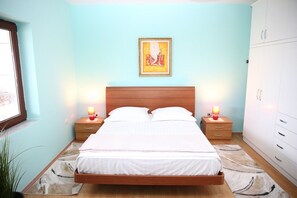 First bedroom has two beds, queen and twin sizes