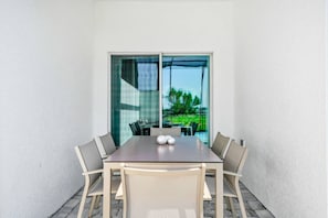 Dine alfresco by the pool in a relaxing outdoor setting.