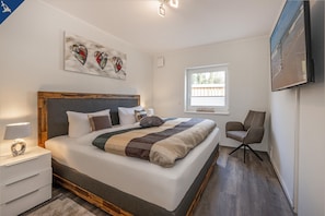 Boxspringbett 200x200cm
Flachbildschirm