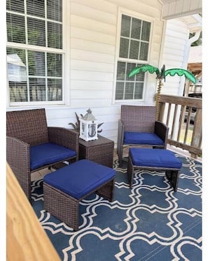 Nice shady porch with ceiling fans.