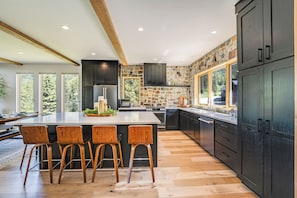 Spacious kitchen with bar seating for six people | Main Level