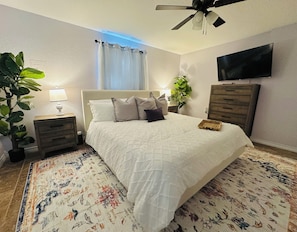 The master is on the main level and has a king bed as well as a large Smart TV.