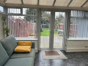 A spacious bright and airy conservatory, creating a spacious and sociable area for cooking, dining, or simply enjoying your morning coffee.