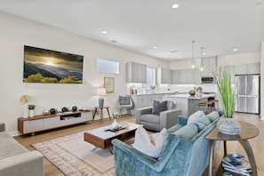 Modern open-concept living room with sleek design and natural light.