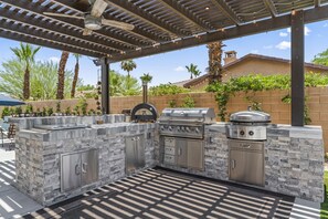 Chef’s Outdoor Kitchen – Fully equipped for grilling and chilling.