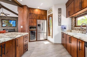 Spacious kitchen with a large island, dishwasher, and fully equipped with everything needed for cooking and entertaining.