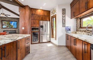 Spacious kitchen with a large island, dishwasher, and fully equipped with everything needed for cooking and entertaining.