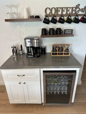 Coffee Bar comes with a full size coffee pot, k cup, ground coffee, beans, cold brew, French Press, a frothier, and amazing to go cups.