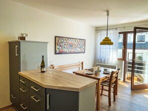 Furniture, Flooring, Interior Design, Countertop, Wood, Cabinetry, Floor, Kitchen, Ceiling, Room