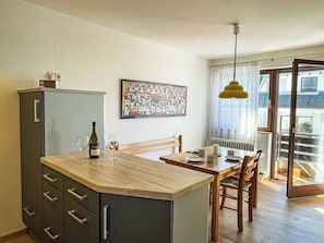 Furniture, Flooring, Interior Design, Countertop, Wood, Cabinetry, Floor, Kitchen, Ceiling, Room