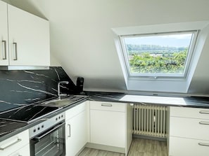 Kitchen, Flooring, Countertop, Interior Design, Floor, Kitchen Appliance, Major Appliance, Ceiling, Cabinetry, Glass