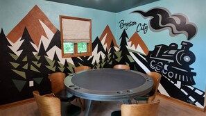 Lower Level Game room with poker, x box, board games, laser tag and more!