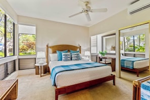 Wake up in paradise! This serene primary suite offers lush garden views, cool A/C, and a comfy king bed—perfect for recharging after Maui adventures. 🌿🛏️