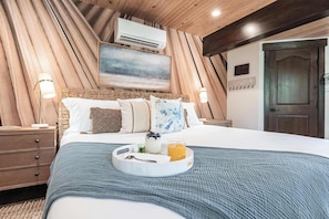 The primary bedroom is a wonderful sanctuary with a large comfortable king sized bed.
