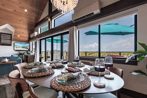 Surrounded by windows and natural light, it’s the perfect setting to relax, connect, the dining area is the perfect place to savor every bite in paradise.