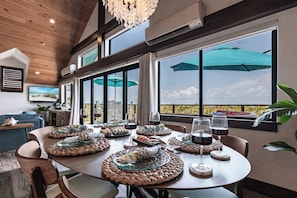 Surrounded by windows and natural light, it’s the perfect setting to relax, connect, the dining area is the perfect place to savor every bite in paradise.