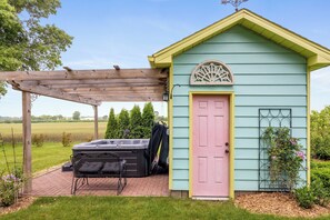 Soak in style beside the cutest pastel shed in the Midwest.