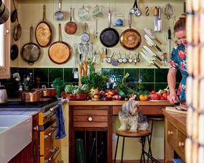 Julia Child's French pegboard kitchen awaits you and your culinary creations.