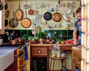 Julia Child's French pegboard kitchen awaits you and your culinary creations.