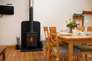 Wood burner heating the open plan living/kitchen area